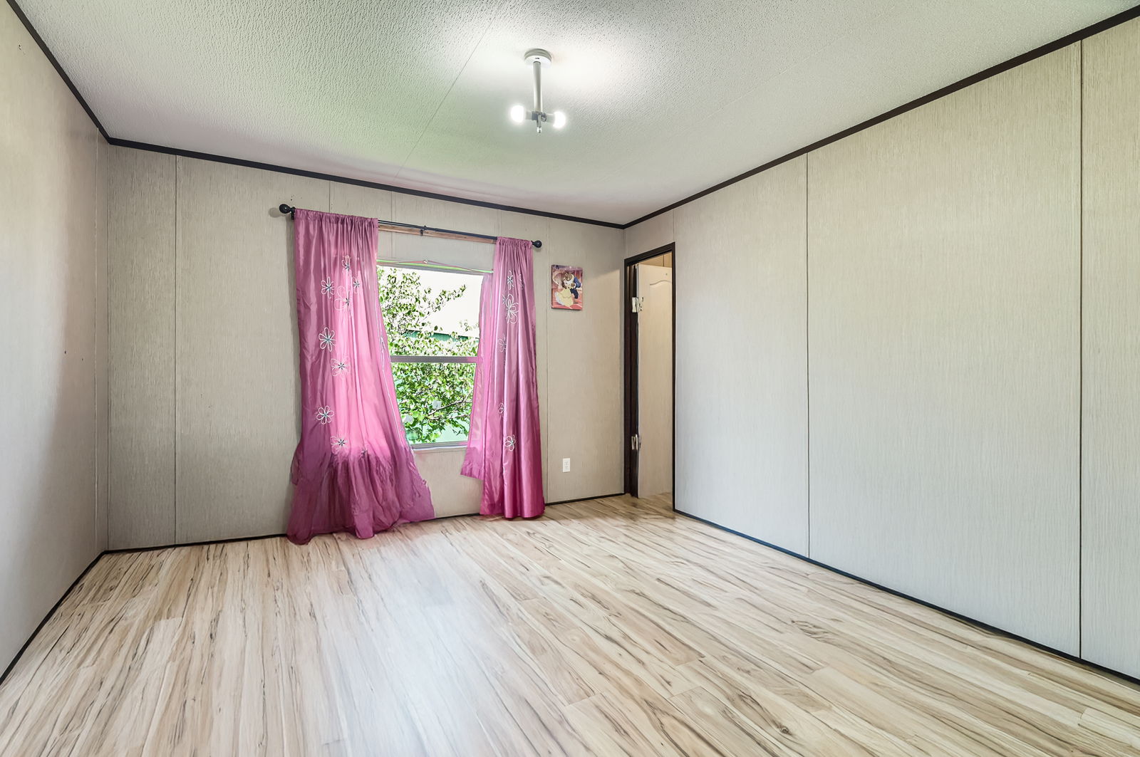 415 County Road 154 Georgetown, TX 78626 - Photo 23 of 28 Empty room featuring wood finished floors, a textured ceiling, and crown molding
