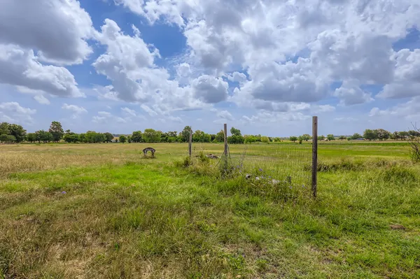 a view of a lake with a big yard