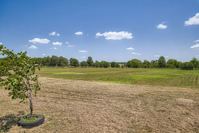 a view of a golf course with a lake