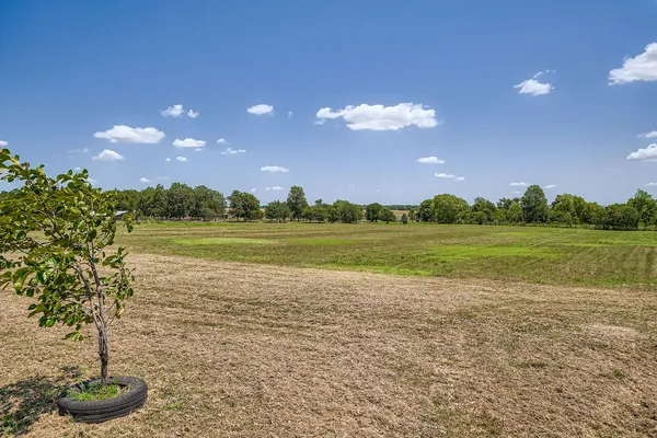 a view of a lake with a big yard
