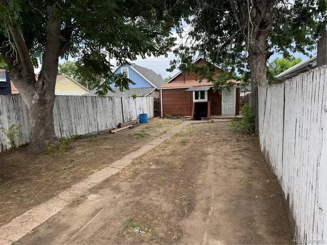 a house with trees in front of it