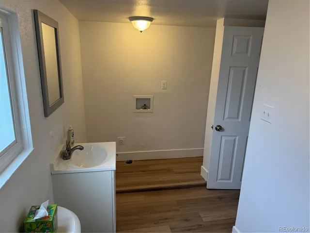 a bathroom with a sink and mirror