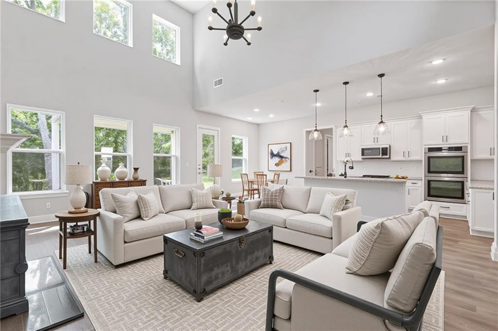 3832 Cheyenne Lane Jefferson, GA 30549 - Photo 3 of 19 a living room with furniture kitchen view and a large window