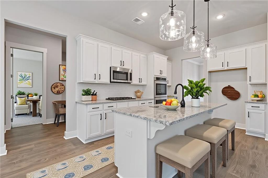 3832 Cheyenne Lane Jefferson, GA 30549 - Photo 4 of 19 a kitchen with cabinets and center island