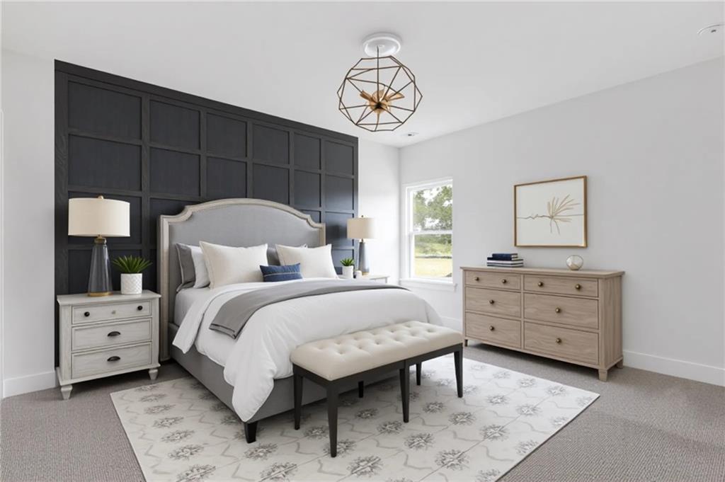 3832 Cheyenne Lane Jefferson, GA 30549 - Photo 7 of 19 a bedroom with a bed and a chandelier