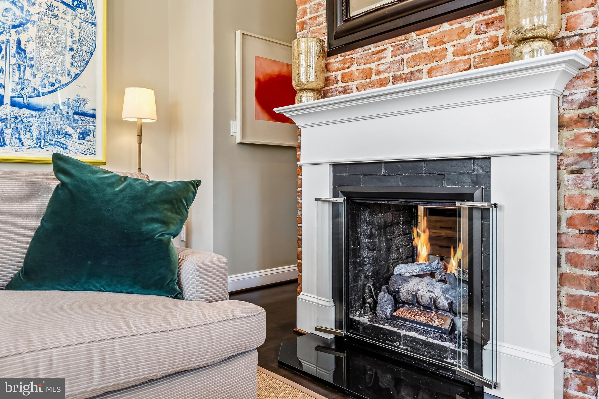1740 13th Street Northwest Washington, DC 20009 - Photo 12 of 40 Classic mantle with double sided gas fireplace