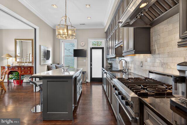 1740 13th Street Northwest Washington, DC 20009 - Photo 36 of 82 a kitchen with stainless steel appliances granite countertop a stove and a view of dining hall with wooden floor