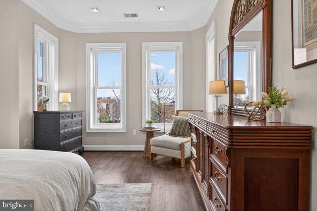 1740 13th Street Northwest Washington, DC 20009 - Photo 49 of 82 a bedroom with a bed and a potted plant on the dresser