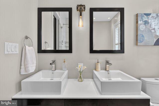 1740 13th Street Northwest Washington, DC 20009 - Photo 52 of 82 a bathroom with double vanity sinks and a mirror