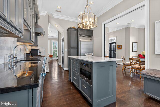 1740 13th Street Northwest Washington, DC 20009 - Photo 7 of 82 a kitchen with stainless steel appliances a stove center island cabinets and a counter top space