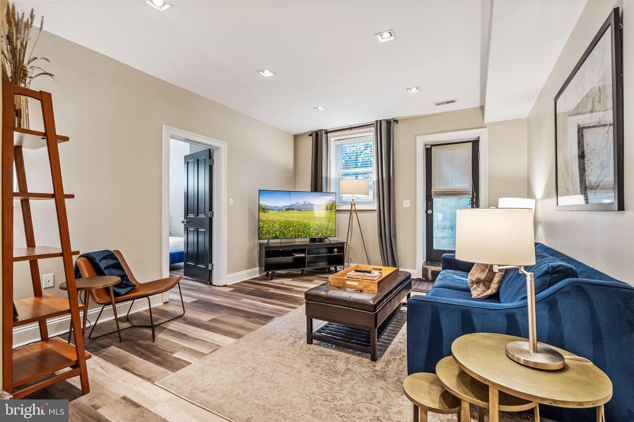 1740 13th Street Northwest Washington, DC 20009 - Photo 71 of 82 a living room with furniture and a wooden floor