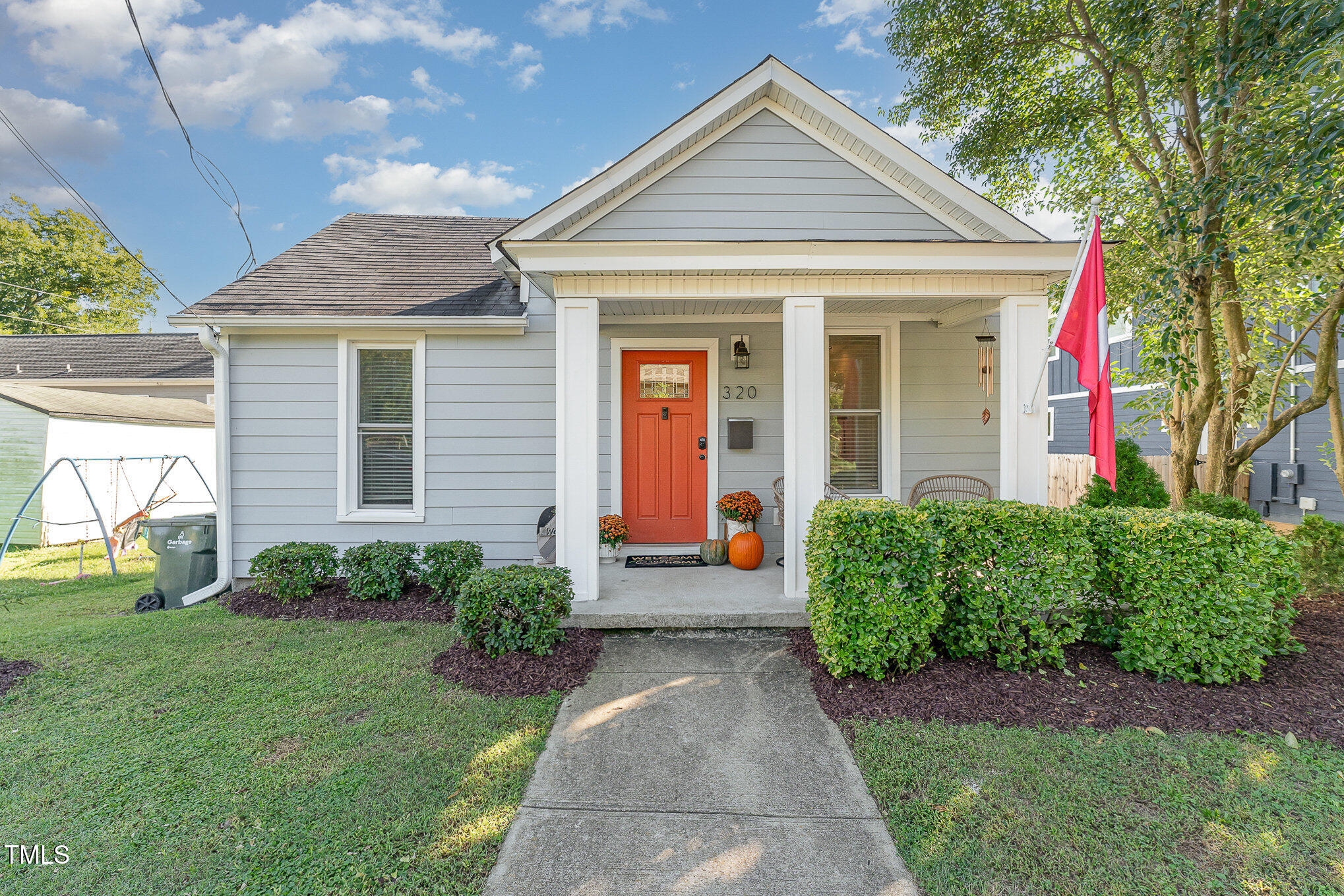 320 East Lee Street Raleigh, NC 27601 - Photo 1 of 31 a front view of a house with garden