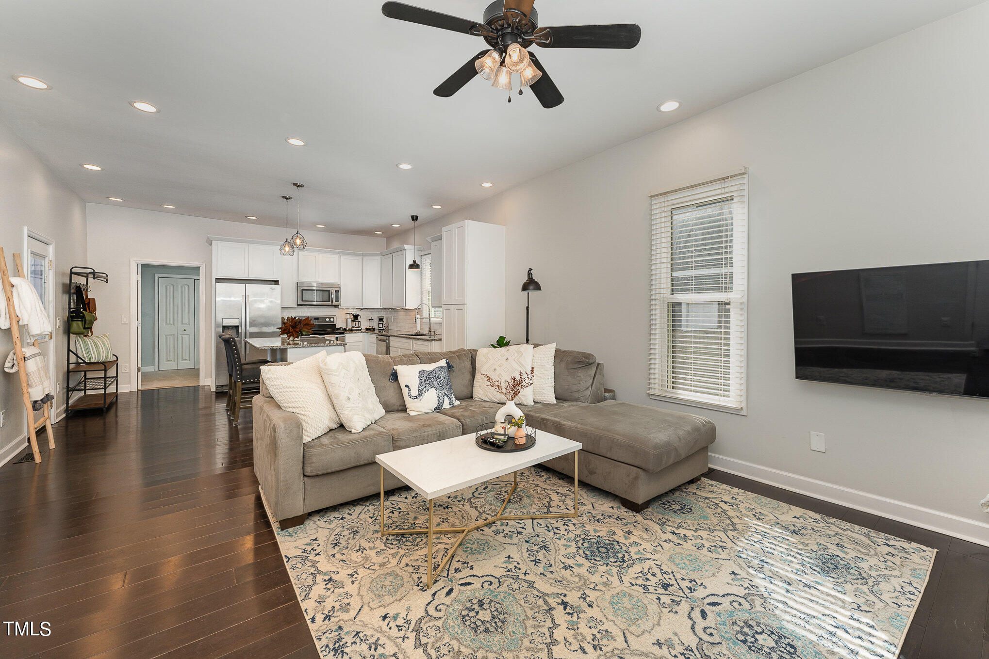 320 East Lee Street Raleigh, NC 27601 - Photo 3 of 31 a living room with furniture and a flat screen tv