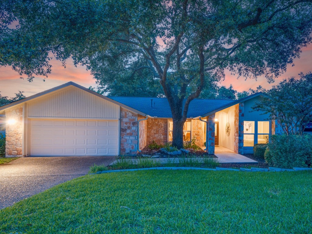 1904 Point Bluff Drive Austin, TX 78746 - Photo 1 of 1 a front view of house with yard and green space