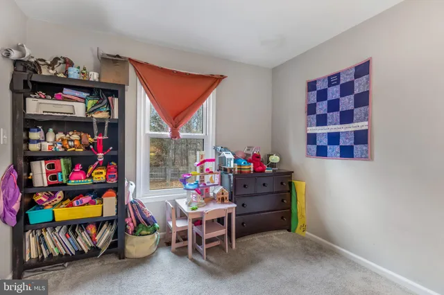 a bathroom with double vanity sinks and a mirror