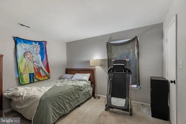 a view of a house with a wooden fence