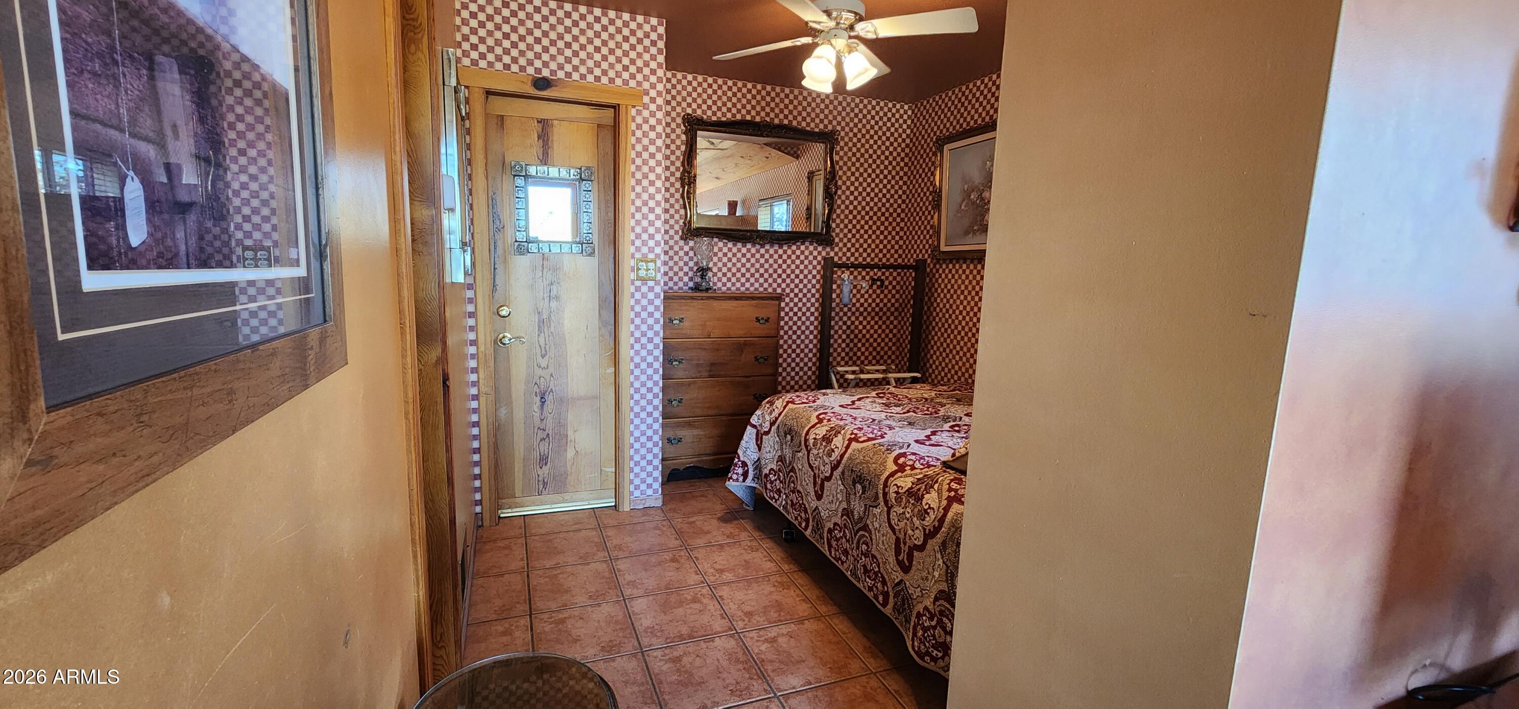 27675 State Highway 89 Congress, AZ 85332 - Photo 13 of 18 a bedroom with a bed and a mirror