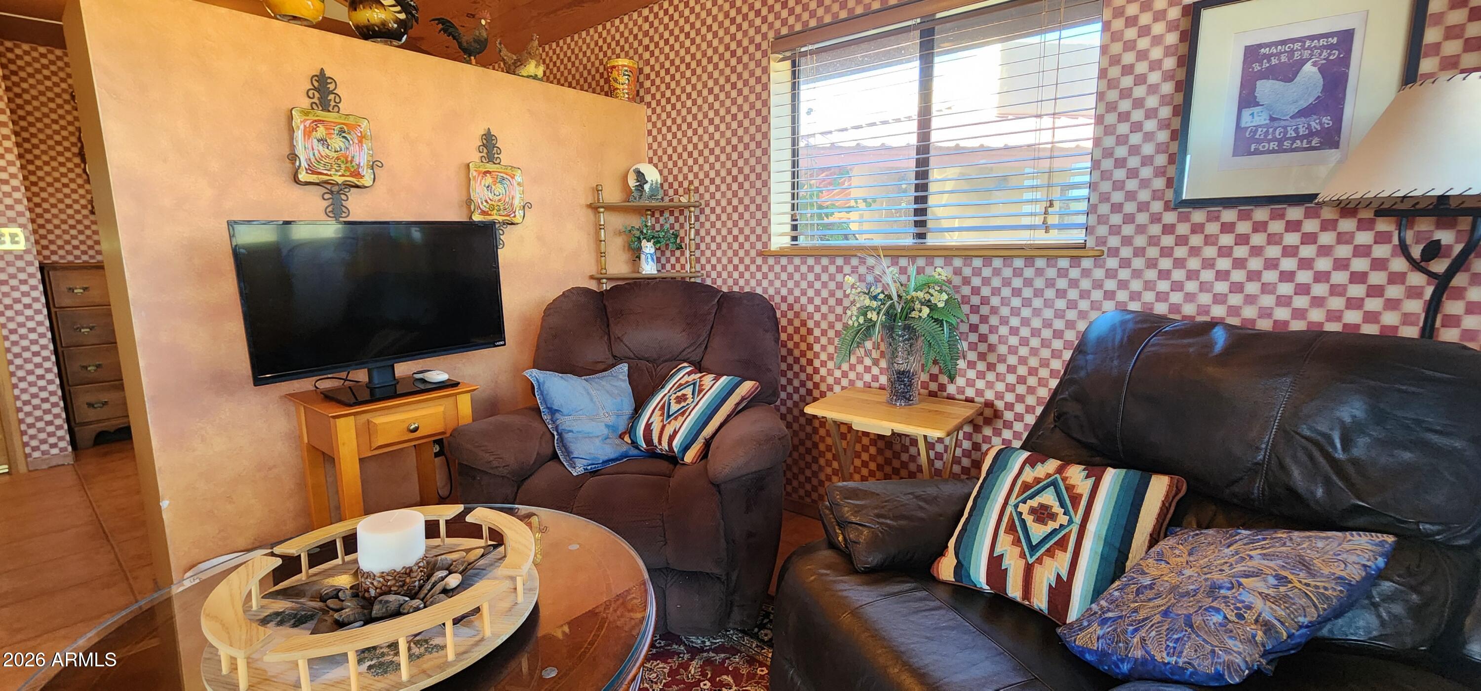 27675 State Highway 89 Congress, AZ 85332 - Photo 6 of 18 a living room with furniture and a flat screen tv