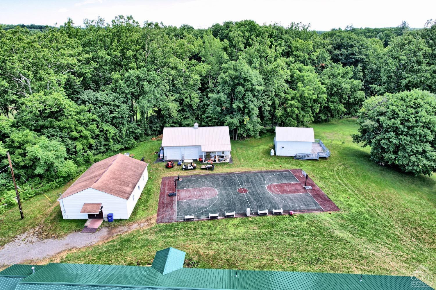 899-907 Red Mill Road Greenville, NY 12083 - Photo 12 of 99 an aerial view of a house with garden space and trees all around