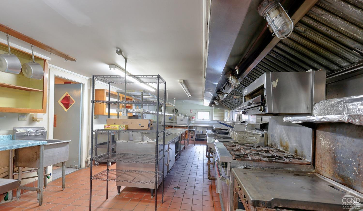 899-907 Red Mill Road Greenville, NY 12083 - Photo 29 of 99 a kitchen with stainless steel appliances granite countertop a stove and cabinets