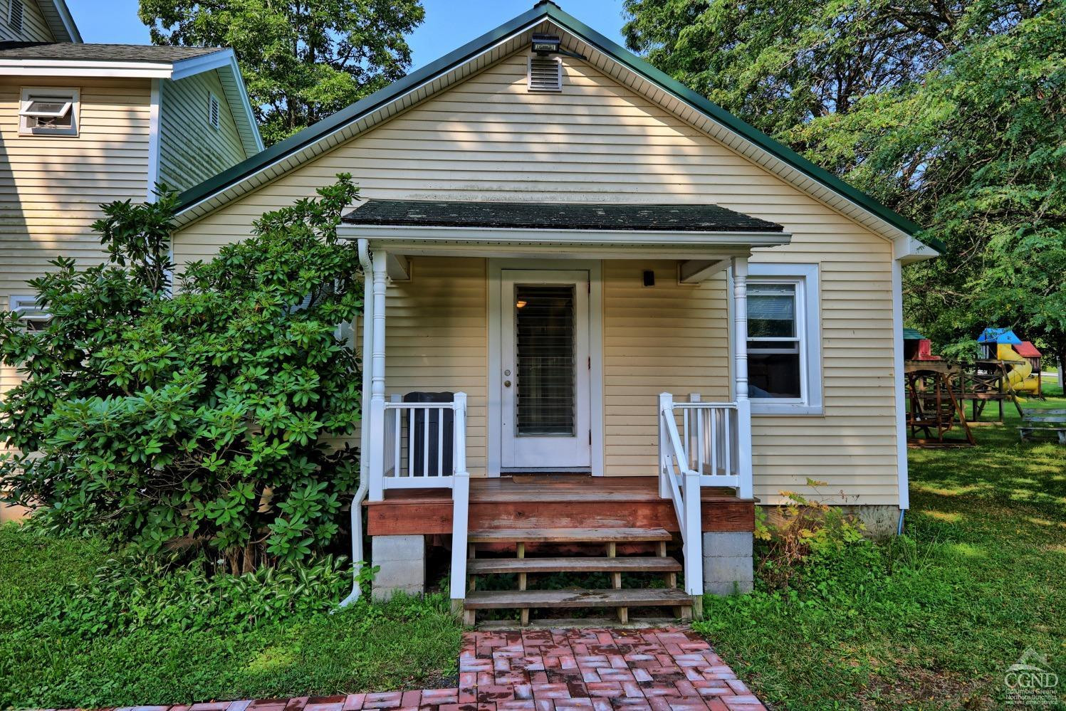 899-907 Red Mill Road Greenville, NY 12083 - Photo 40 of 99 a front view of a house with a yard