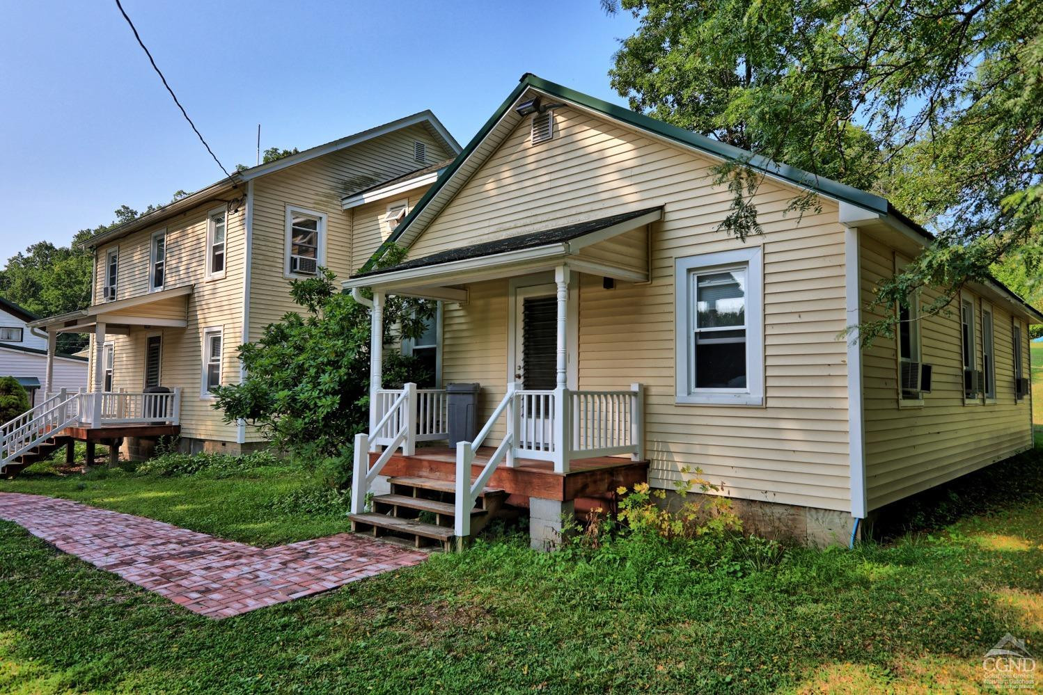 899-907 Red Mill Road Greenville, NY 12083 - Photo 41 of 99 a view of a house with a yard chairs and a big yard