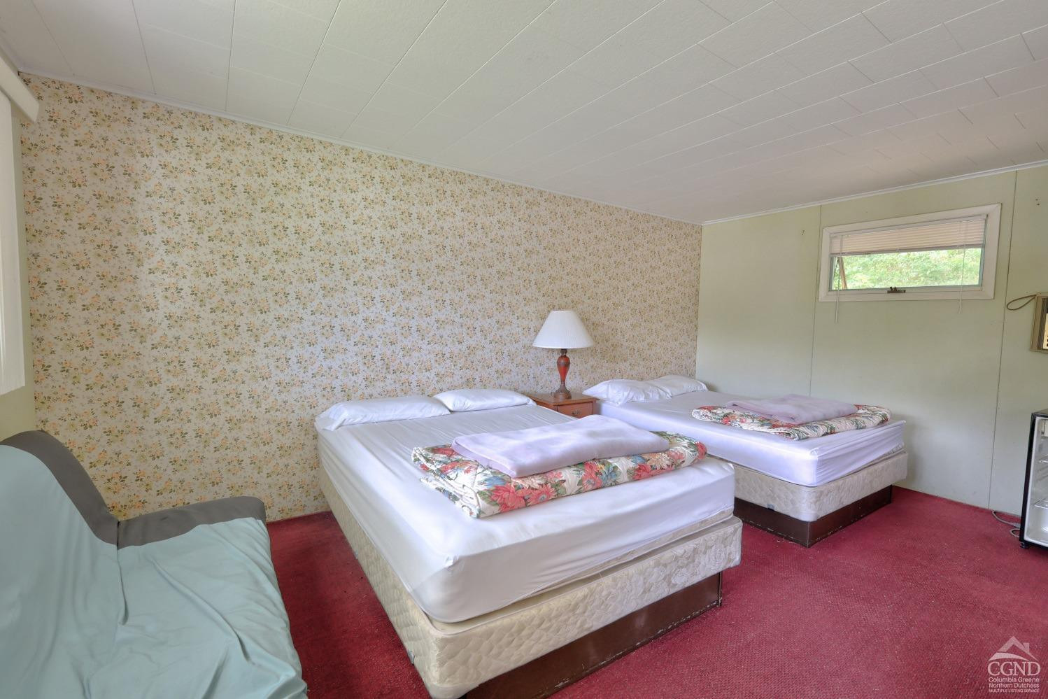 899-907 Red Mill Road Greenville, NY 12083 - Photo 68 of 99 a bedroom with a bed and a couch