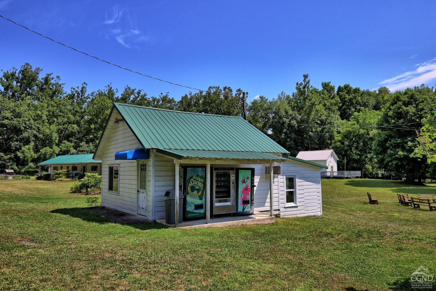 899-907 Red Mill Road Greenville, NY 12083 - Photo 89 of 99 a front view of a house with a garden