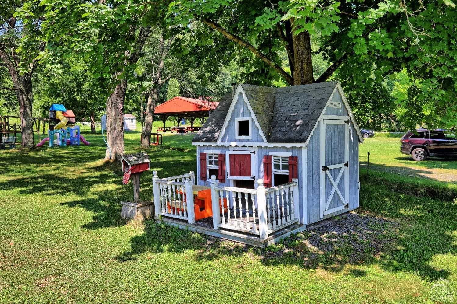 899-907 Red Mill Road Greenville, NY 12083 - Photo 92 of 99 a view of a small yard in front of a house with wooden fence