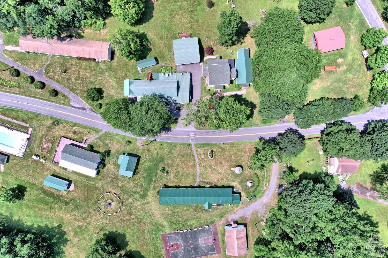899-907 Red Mill Road Greenville, NY 12083 - Photo 94 of 99 an aerial view of a house with a garden and swimming pool