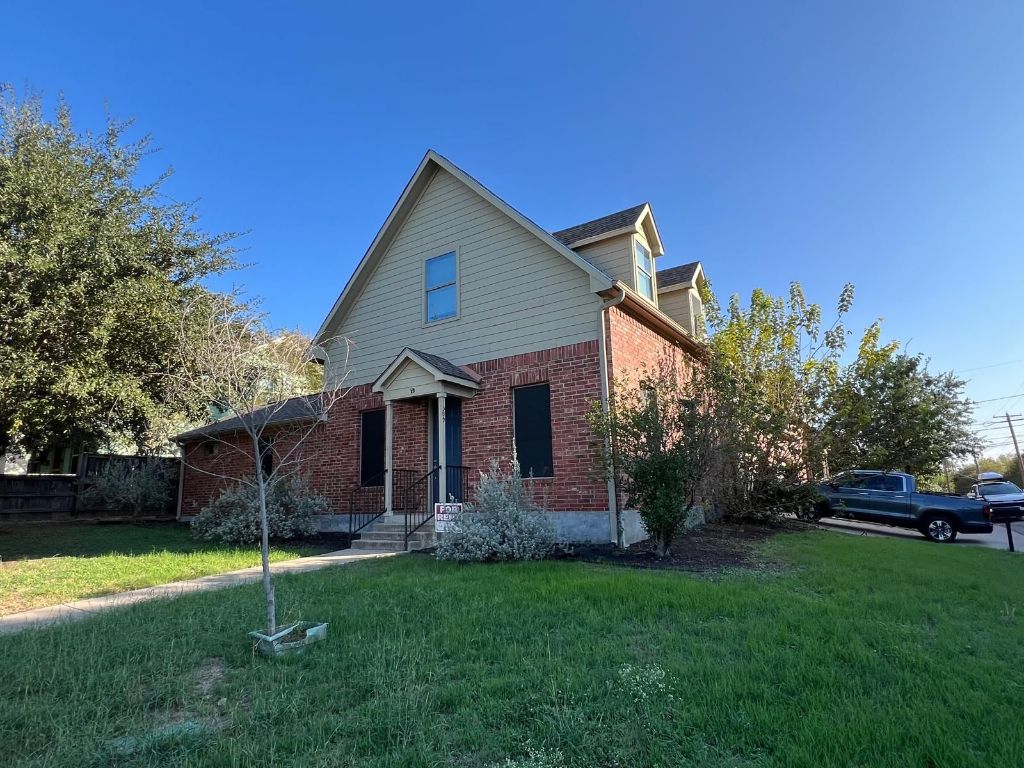 1309 Olander Street, Unit B Austin, TX 78702 - Photo 2 of 17 a view of a house with a yard