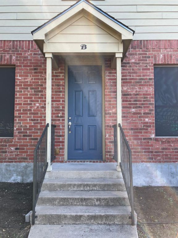 1309 Olander Street, Unit B Austin, TX 78702 - Photo 3 of 17 a front view of a house with stairs