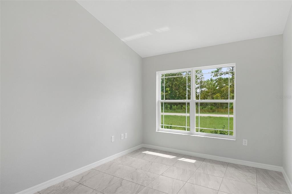 79 Daisy Street Homosassa, FL 34446 - Photo 15 of 36 a view of an empty room with a window