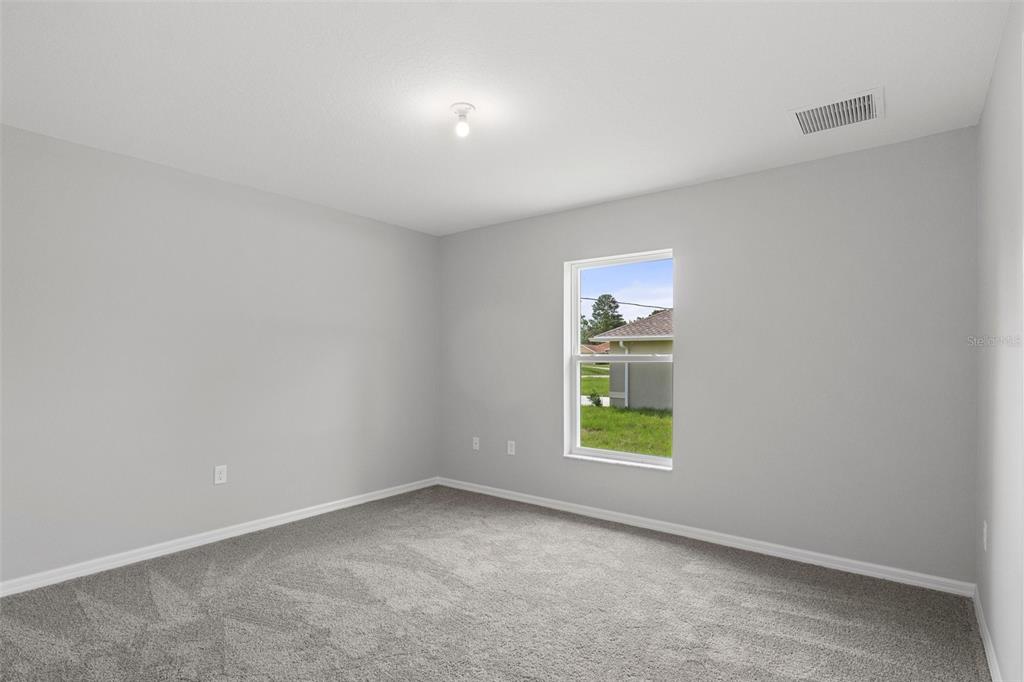 79 Daisy Street Homosassa, FL 34446 - Photo 29 of 36 an empty room with windows