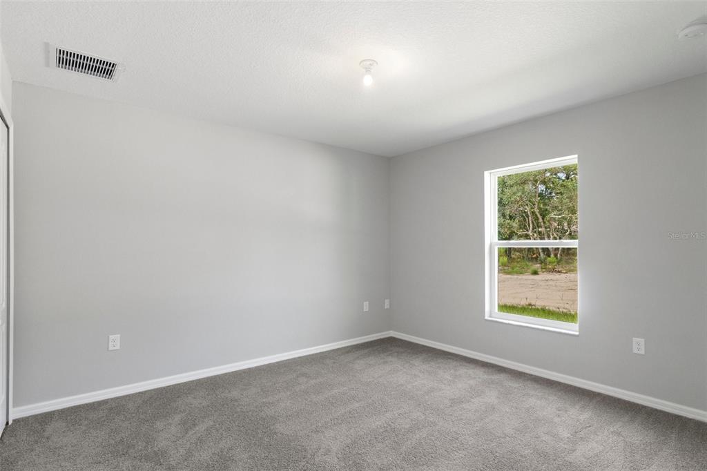 79 Daisy Street Homosassa, FL 34446 - Photo 31 of 36 an empty room with a window