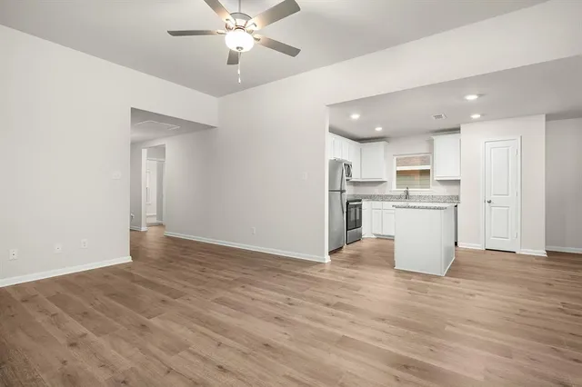 a view of kitchen with wooden floor