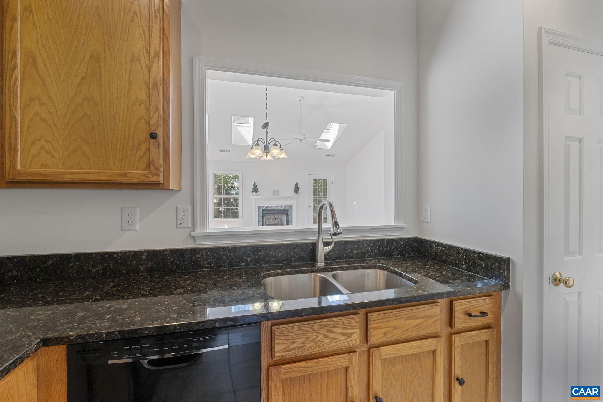 298 Northridge Road Ruckersville, VA 22968 - Photo 12 of 33 a kitchen with granite countertop a sink and cabinets