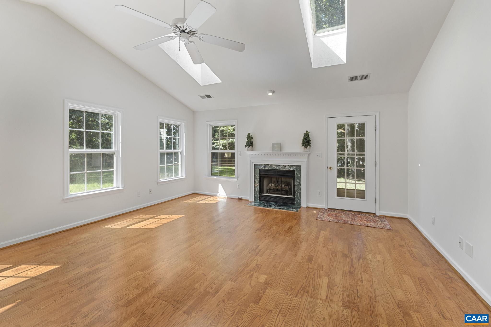 298 Northridge Road Ruckersville, VA 22968 - Photo 15 of 33 an empty room with windows fireplace and a sink