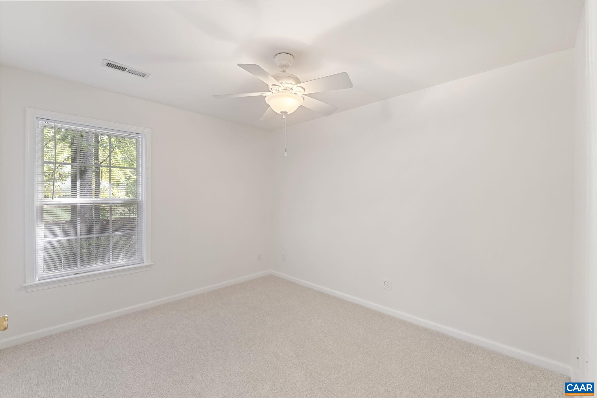 298 Northridge Road Ruckersville, VA 22968 - Photo 25 of 33 an empty room with a window and a fan