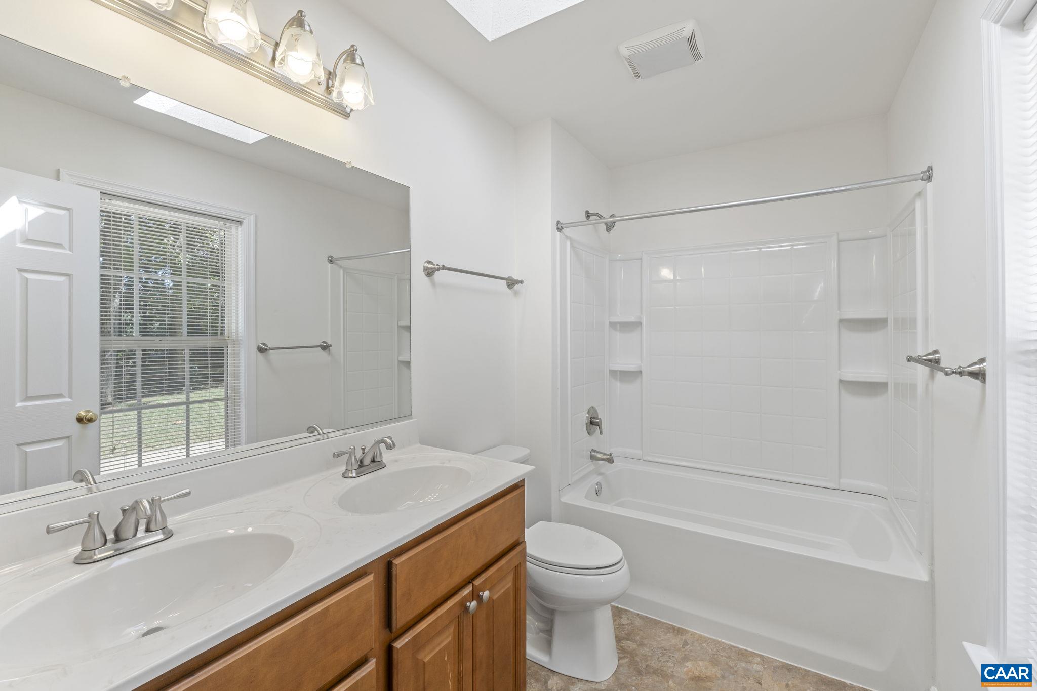 298 Northridge Road Ruckersville, VA 22968 - Photo 26 of 33 a bathroom with a sink a toilet and shower