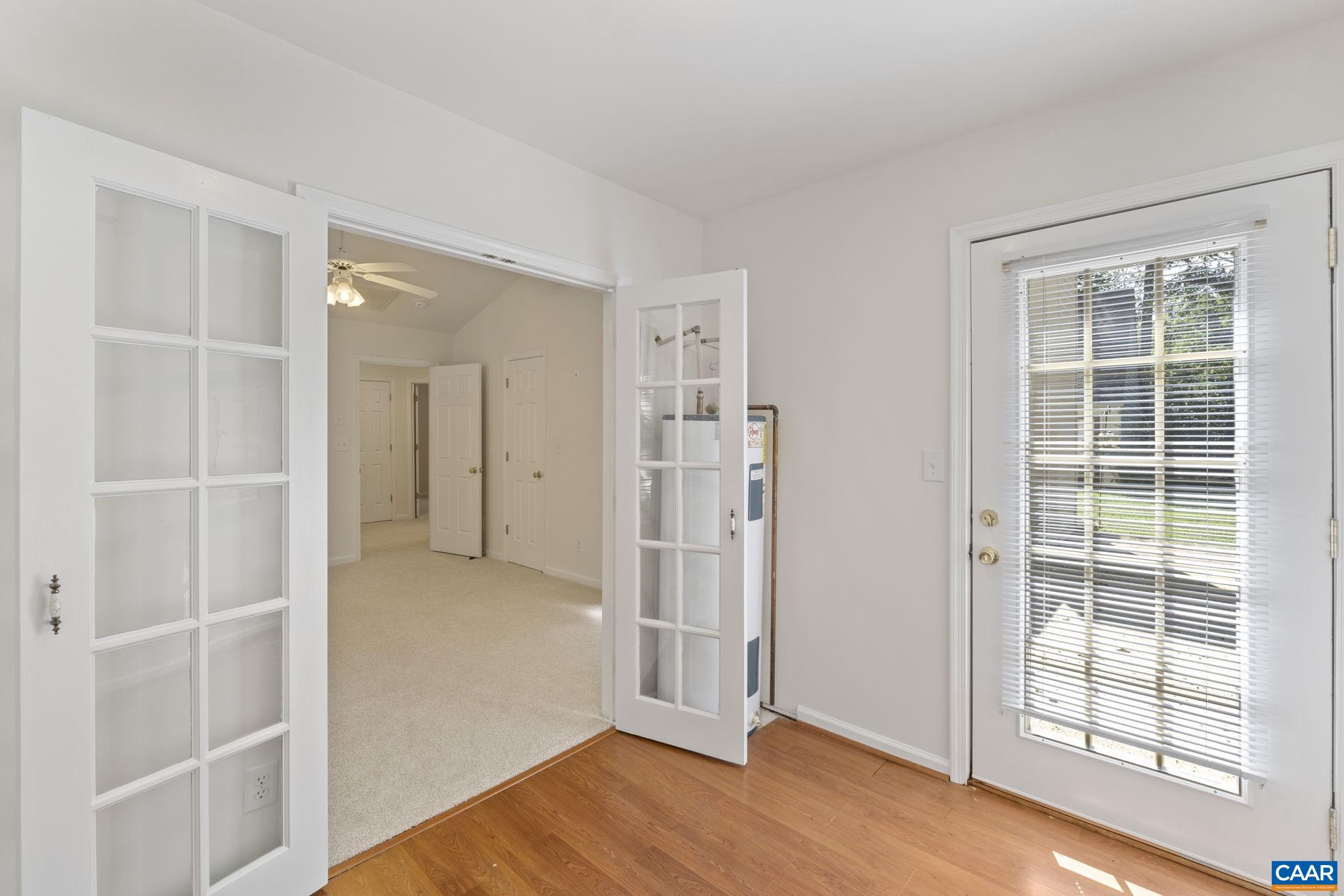298 Northridge Road Ruckersville, VA 22968 - Photo 28 of 33 an empty room with wooden floor and windows