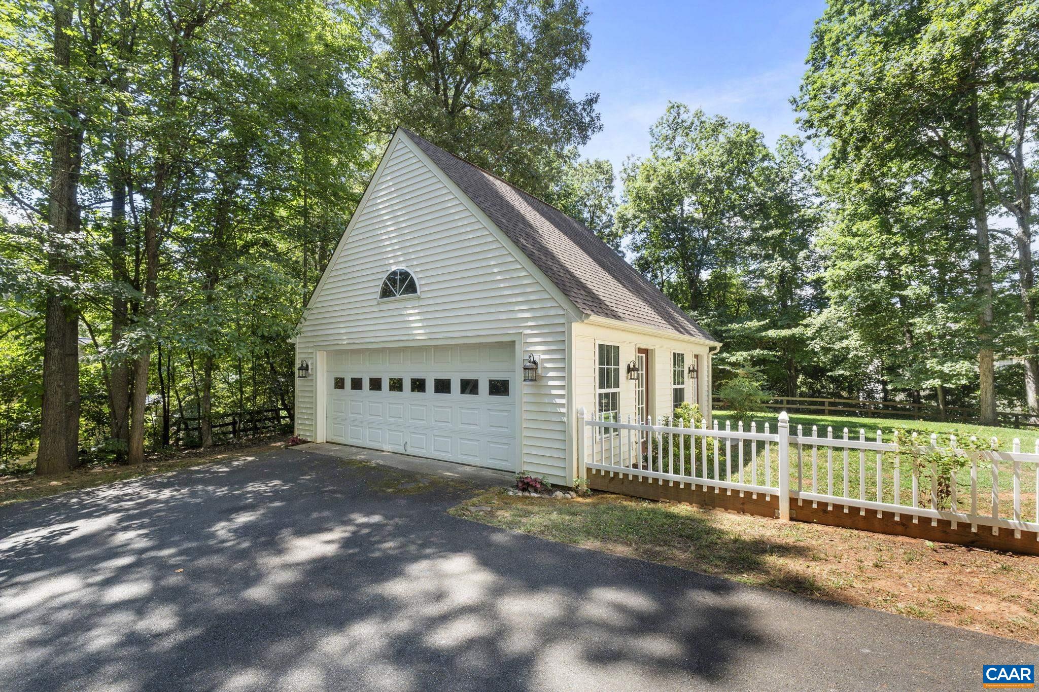 298 Northridge Road Ruckersville, VA 22968 - Photo 3 of 33 a view of a house with a small yard plants and large trees