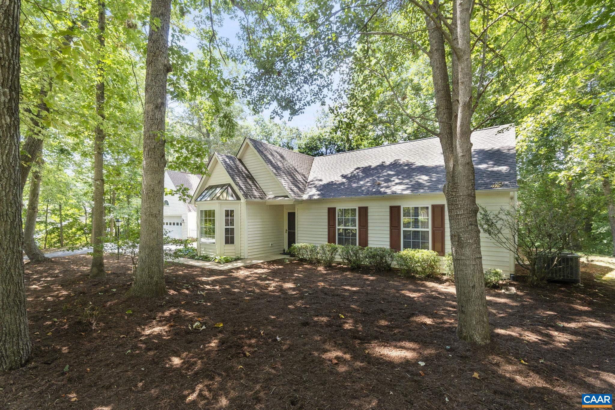 298 Northridge Road Ruckersville, VA 22968 - Photo 4 of 33 a front view of a house with a garden