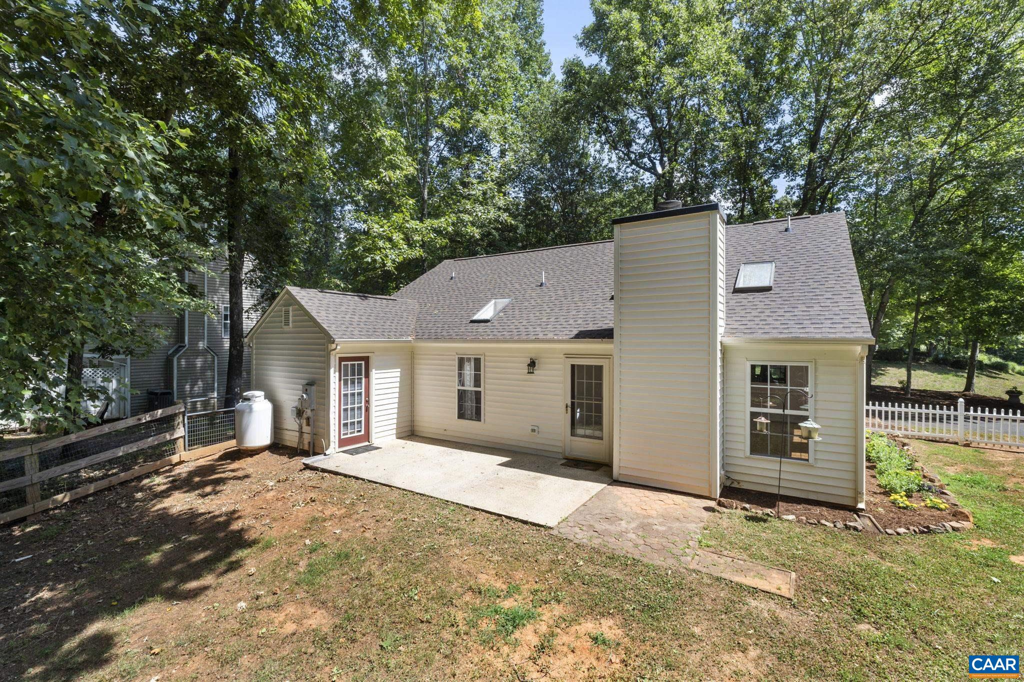 298 Northridge Road Ruckersville, VA 22968 - Photo 5 of 33 a front view of a house with a yard and garage