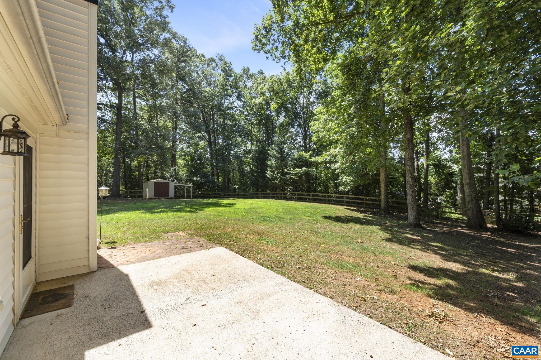 298 Northridge Road Ruckersville, VA 22968 - Photo 6 of 33 a view of a backyard with large trees