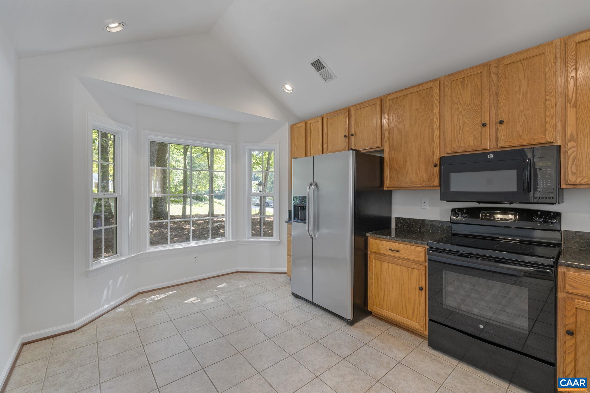 298 Northridge Road Ruckersville, VA 22968 - Photo 9 of 33 a kitchen with stainless steel appliances a refrigerator a stove a sink and a window