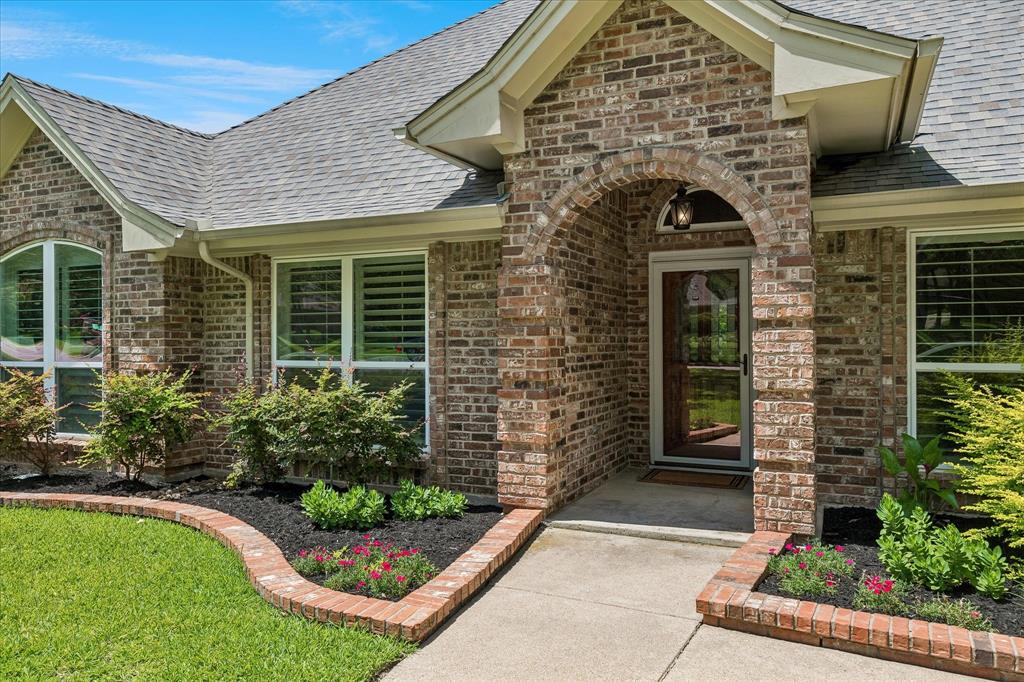 404 Moonlight Lane Keller, TX 76248 - Photo 2 of 40 a front view of a house with a garden