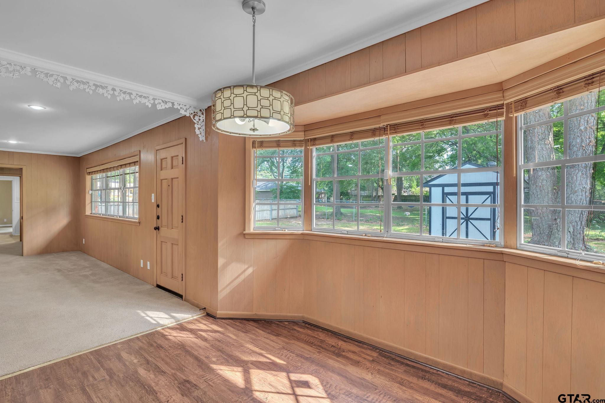700 Emily Drive Longview, TX 75601 - Photo 14 of 45 a view of an empty room with a window and chandelier fan