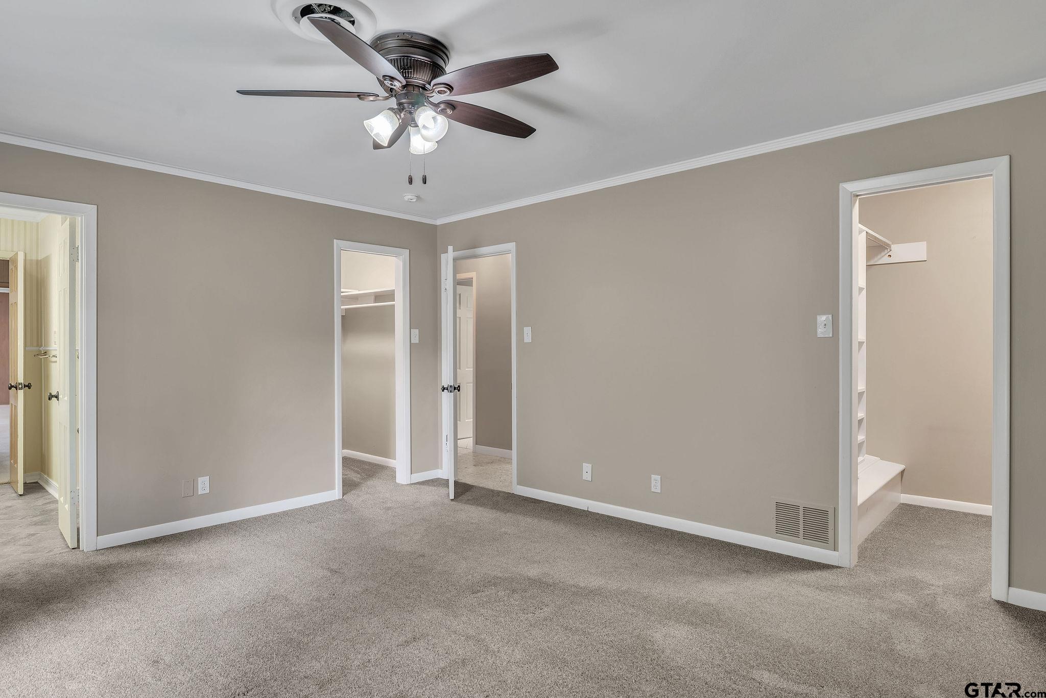700 Emily Drive Longview, TX 75601 - Photo 22 of 45 a view of an empty room with a ceiling fan