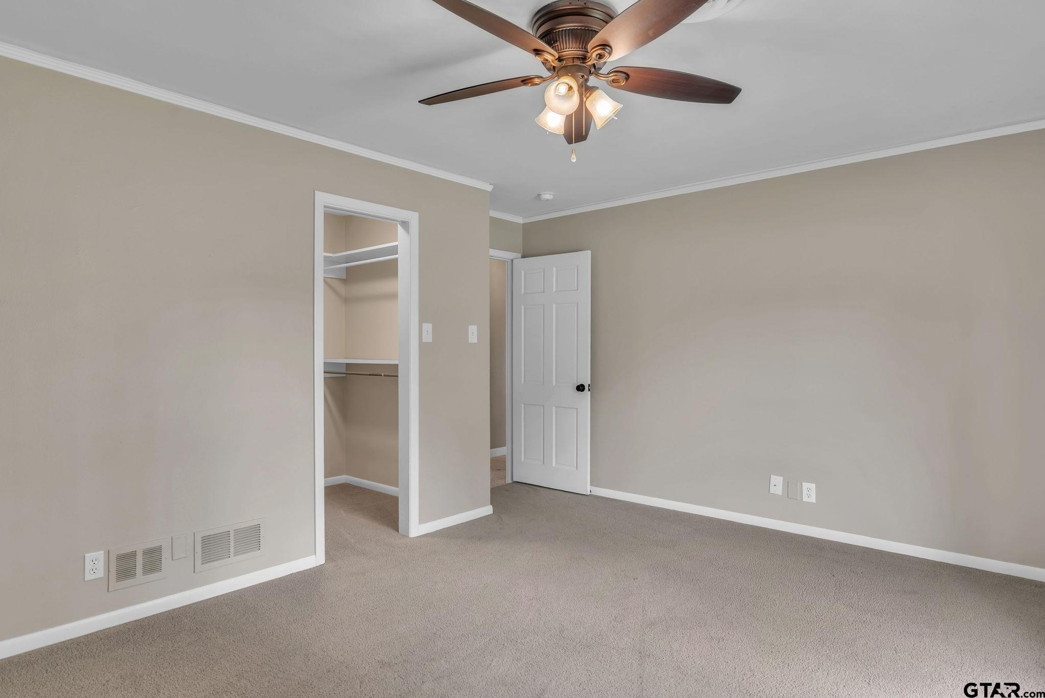 700 Emily Drive Longview, TX 75601 - Photo 26 of 45 an empty room with chandelier fan
